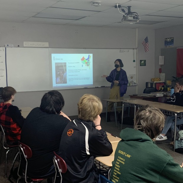 Qianqian Wu introducing herself to the high school class