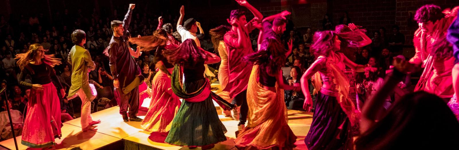 Students dancing in colorful clothing