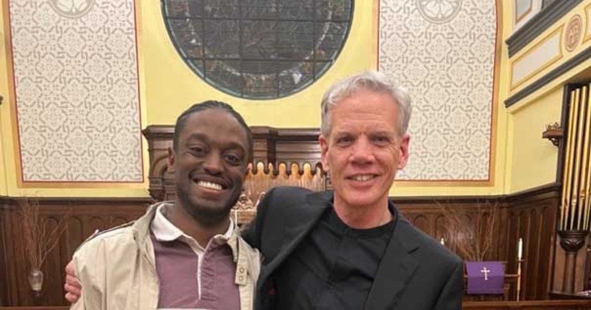 John Rommereim and Austin Morris stand arm and arm