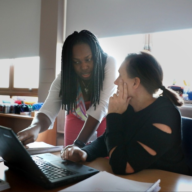 Kaydi-Ann Newsome offering help to a student