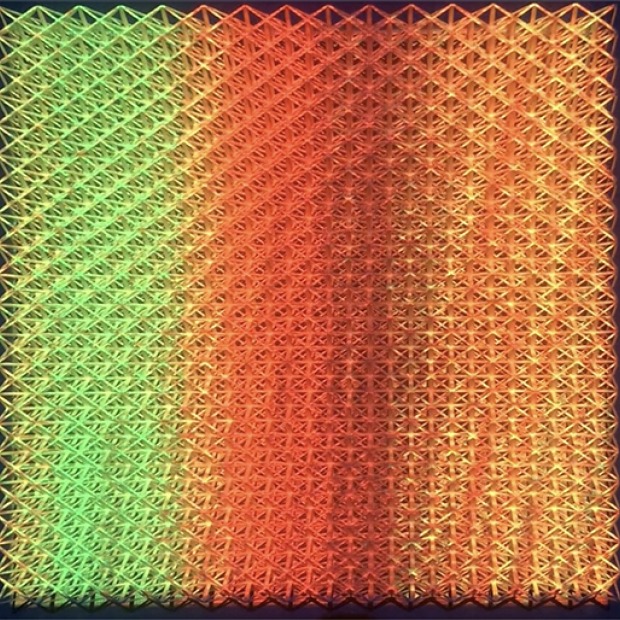 Image of Matthew Kluber's artwork, showing three vertical bands of green, red, and orange projected light.