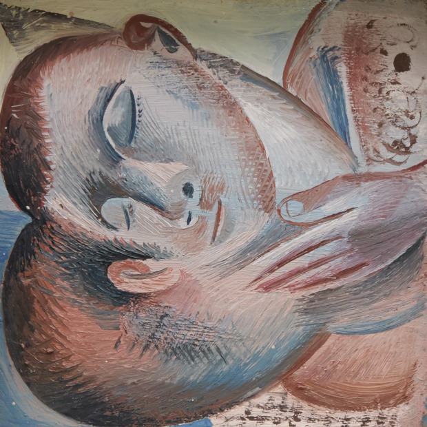 Two men laying side by side in an intimate gesture