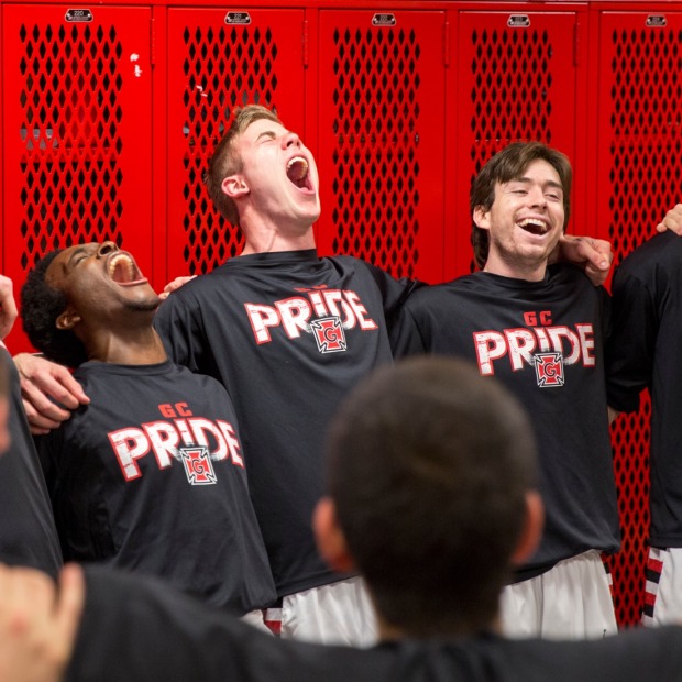 Grinnell men's team celebrates in locker room