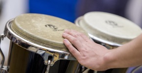 Student playing instrument during Mark Laver, Assistant Professor of Music Rehearsal