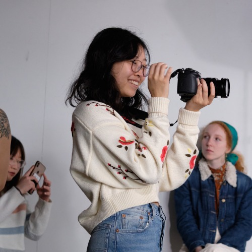 Nana Okamoto ’20 looks through the camera during Fundamentals of Video Production class