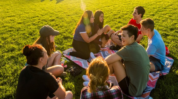 Students laughing on a field