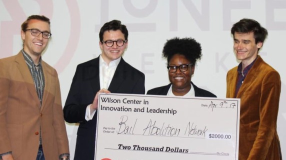 Bail Abolition Network receives a $2000 check during Pioneer Weekend.