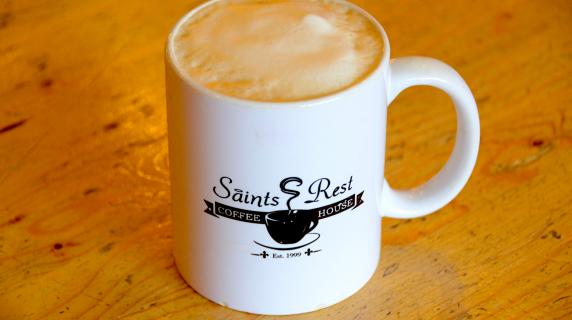 Coffee cup with Saints Rest logo