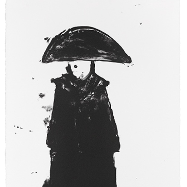 A black and white image of a figure dressed in a Napoleonic had and black overcoat facing the viewer.