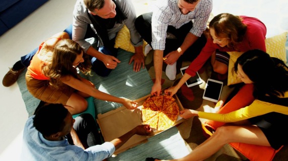 Friends sharing pizza