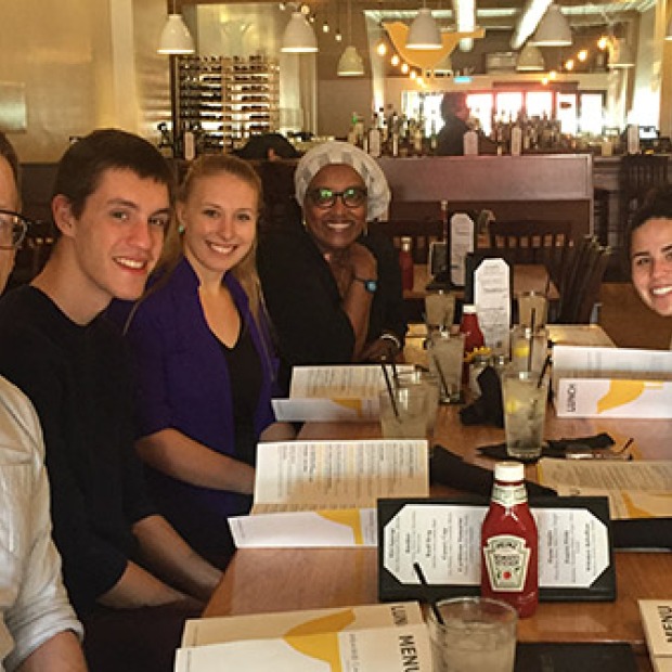 Mixed group of faculty and students sitting in a restaurant