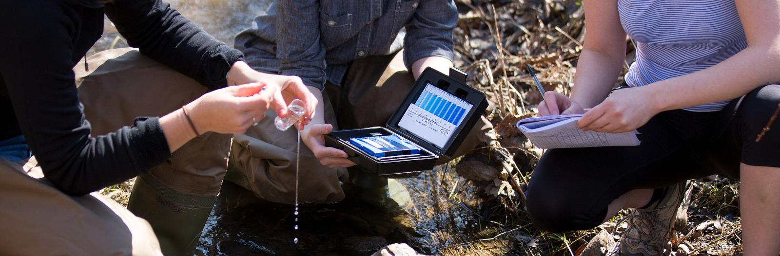 Students taking water samples out at CERA