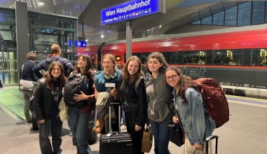 A group of students in a train station in Europe