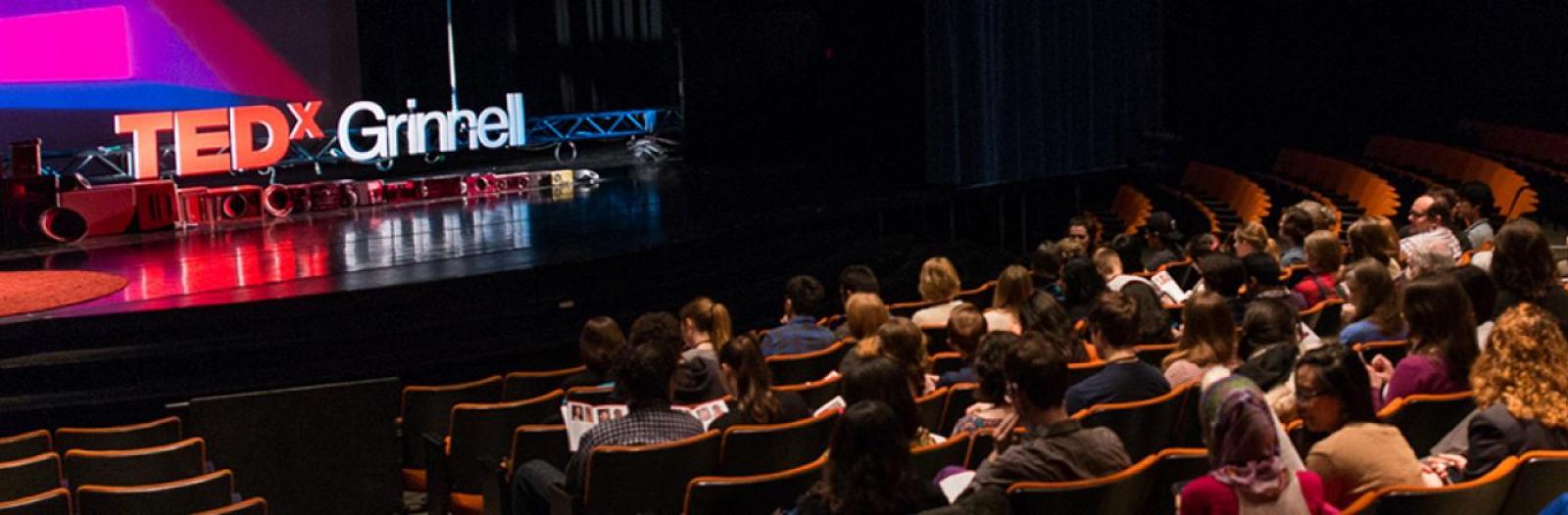 Crowd and stage at TEDxGrinnell