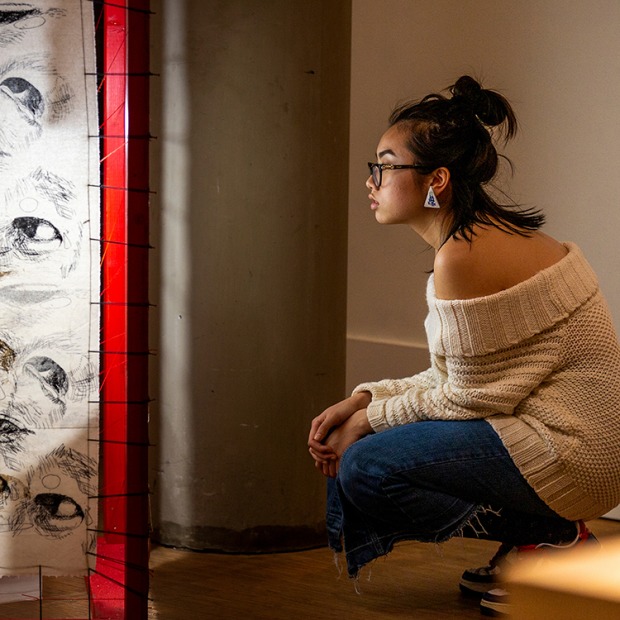 Student viewing sculpture in the Museum of Art