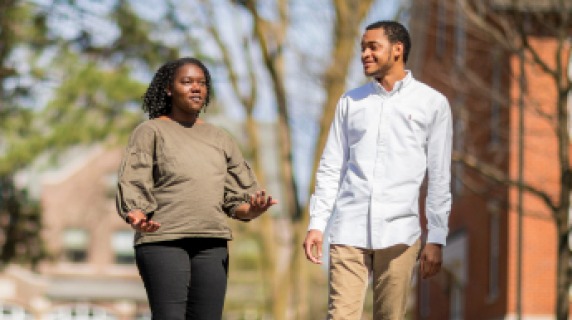 Two students walking on campus