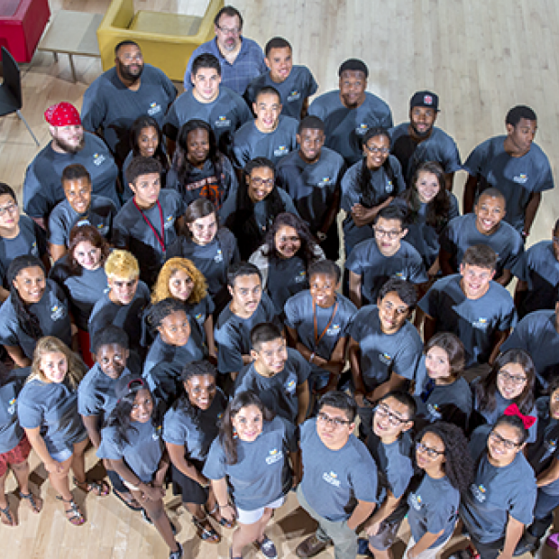 A large group of students in matching T-shirts