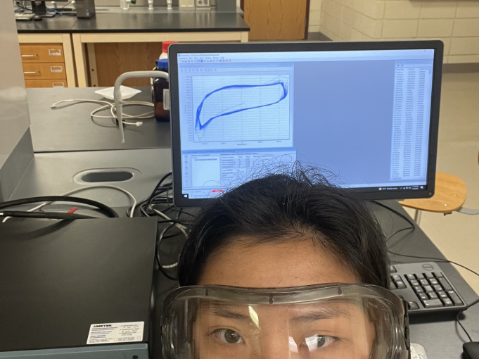 Mia takes a selfie with safety lab goggles on