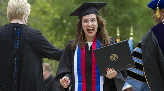 Student celebrates after receiving degree