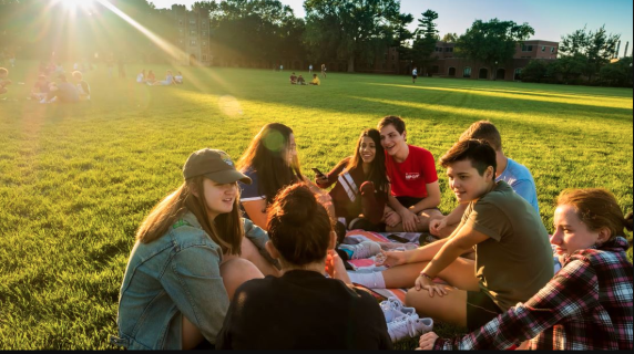 Students smiling on a field