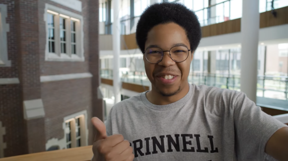 David Hudson '23 smiles and gives a thumbs up  