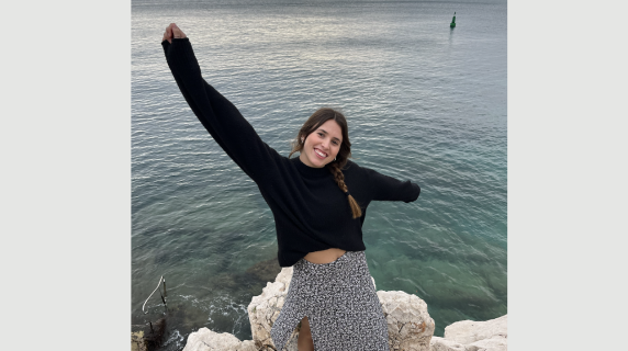 A woman smiles for a photo